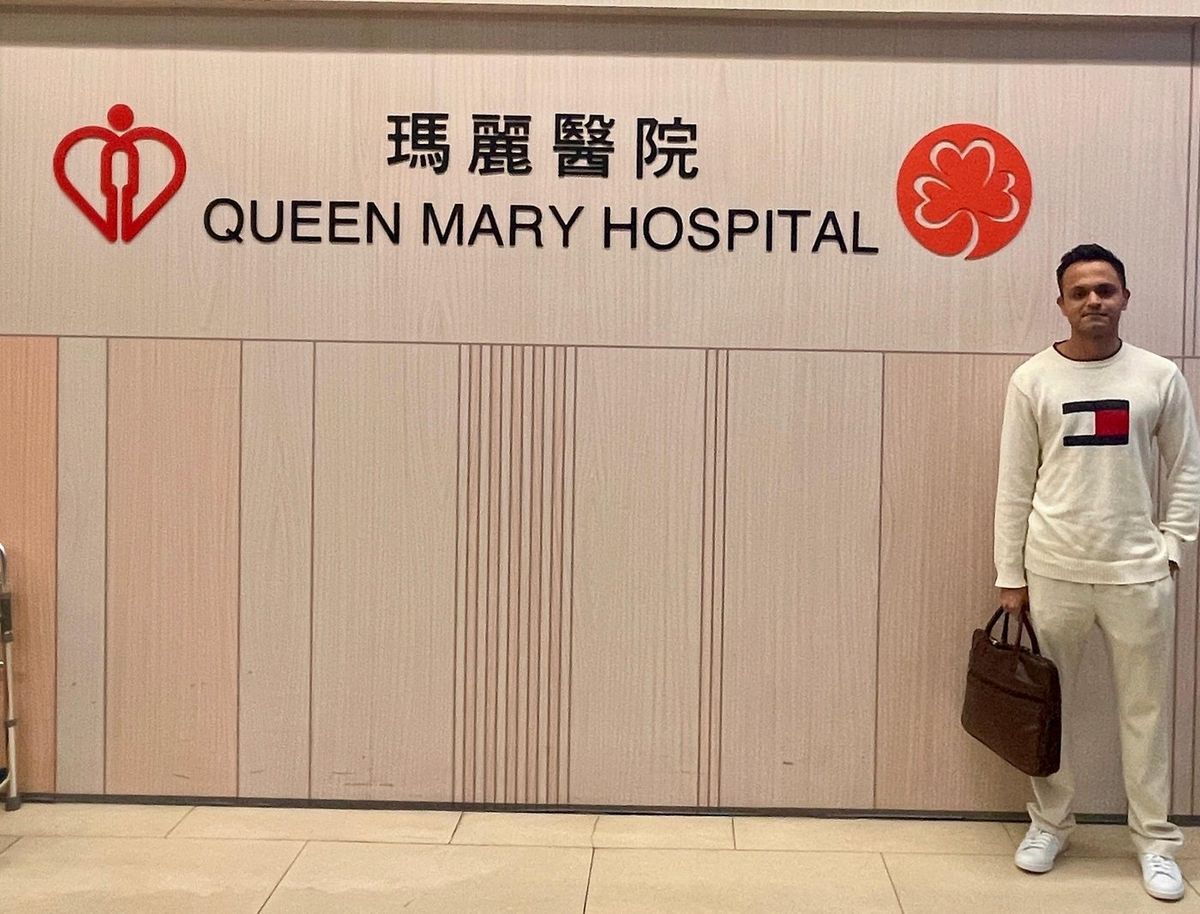 Dr. Avinash Kachare at the entrance to Queen Mary Hospital, Hong Kong
